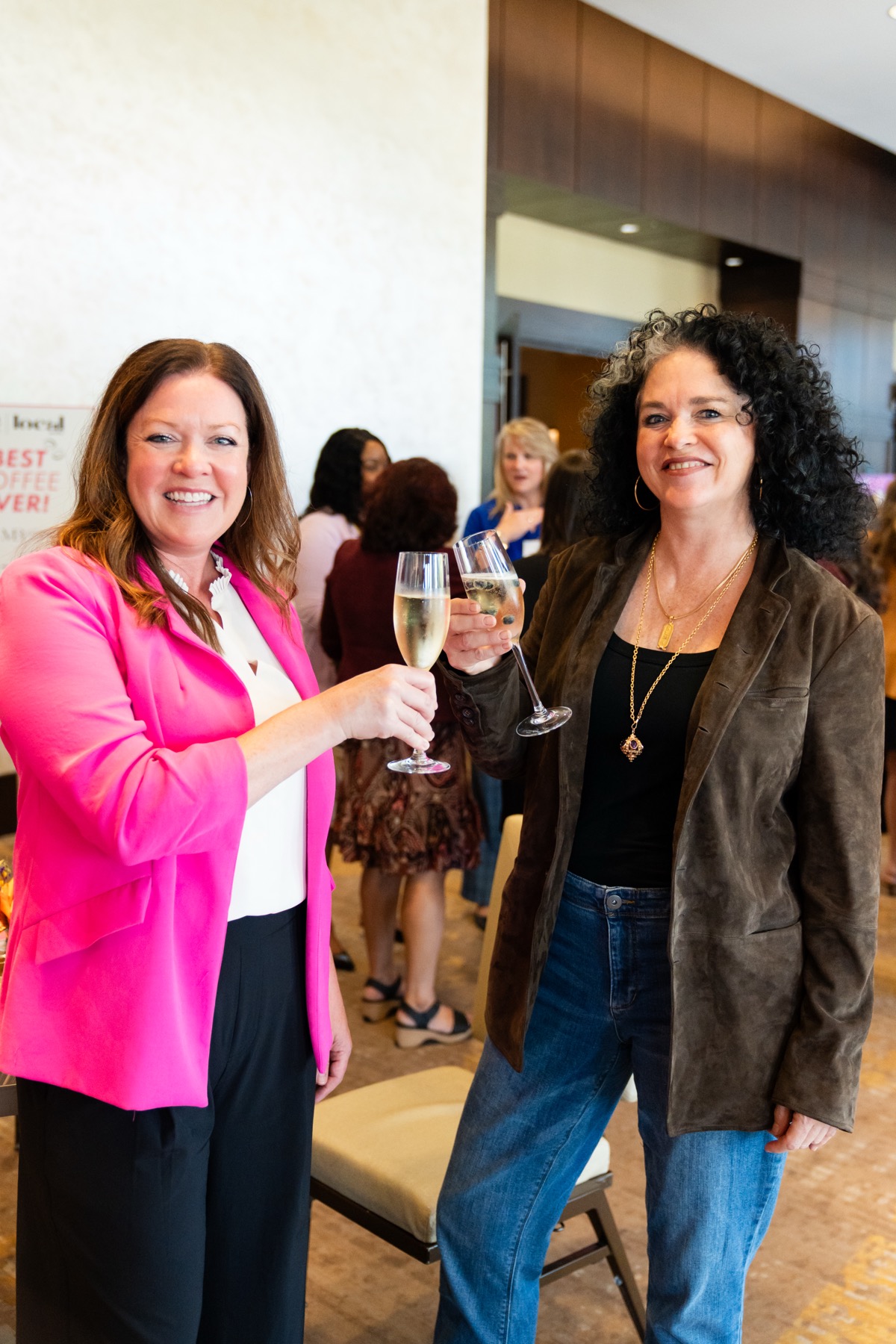 Women in Business Summit — attendees celebrating with champagne
