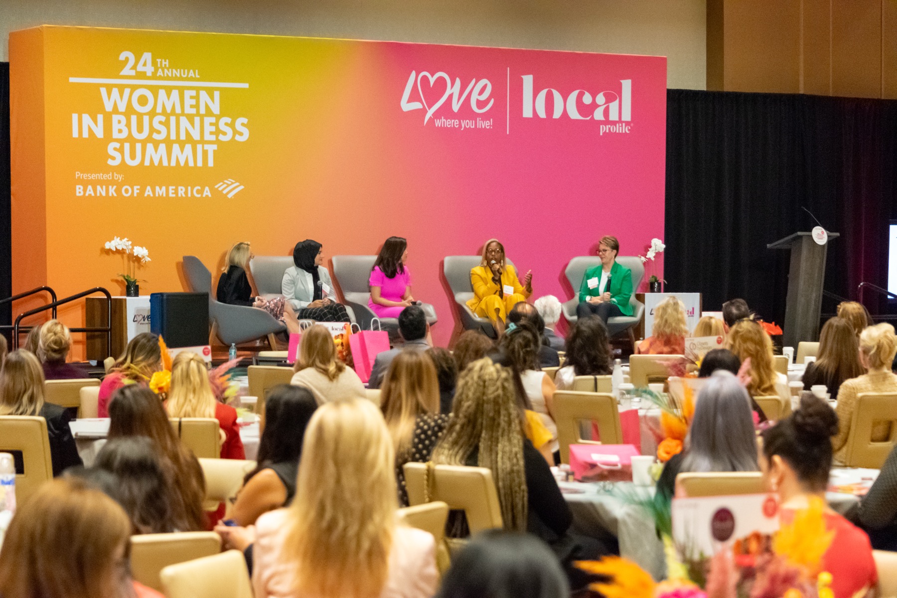 Women in Business Summit — full room with panel on stage